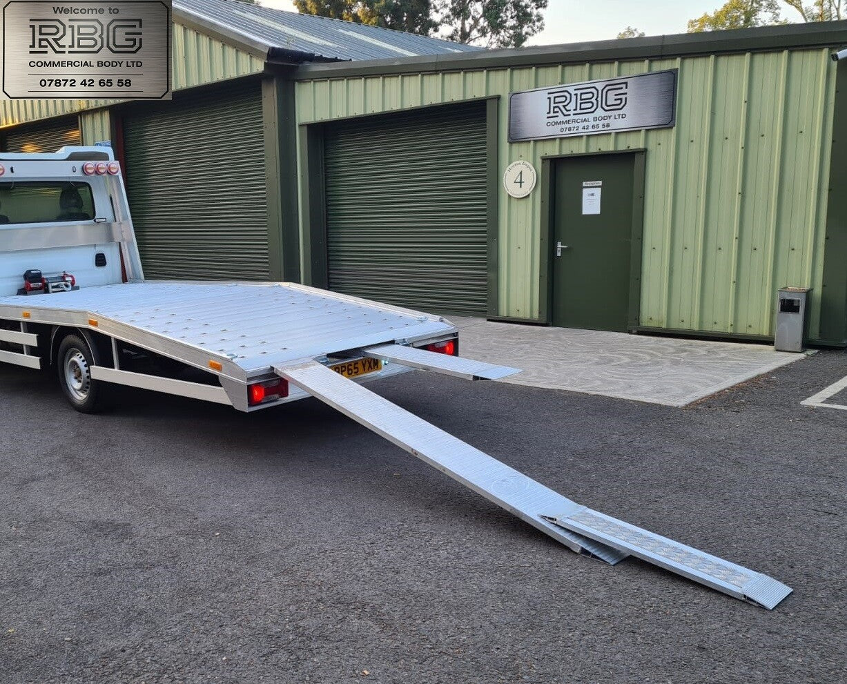 Aluminum car loading ramp extensions for recovery trucks.