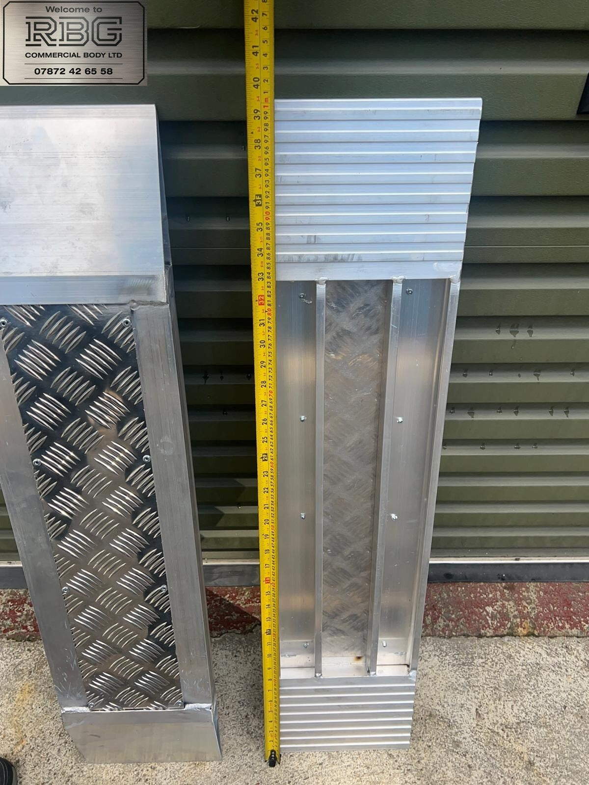 Aluminum car loading ramp extensions for recovery trucks.