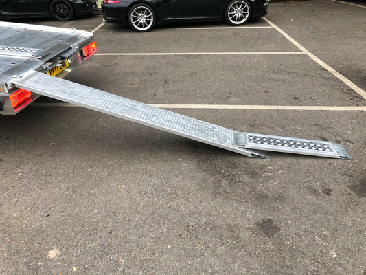 Aluminum car loading ramp extensions for recovery trucks.